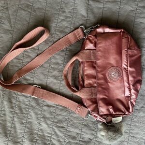 Kipling Pink Crossbody Bag with Adjustable Strap and Durable Design